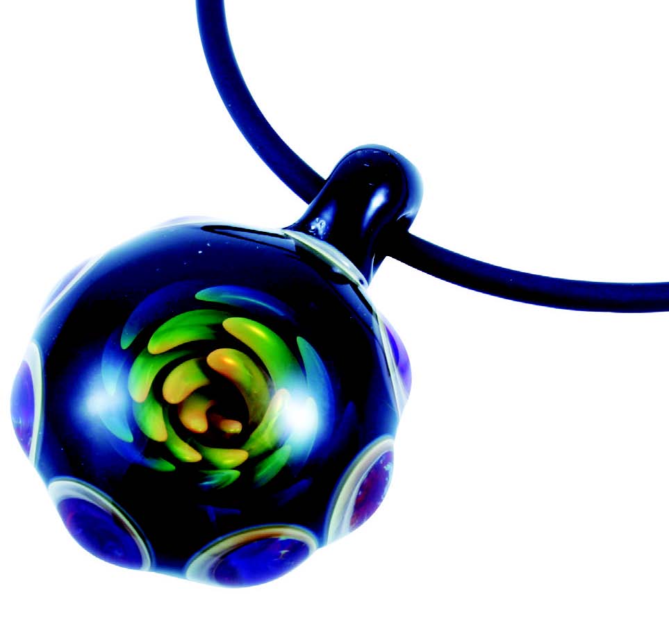 Glass pendant with blue and green swirls hanging from necklace.